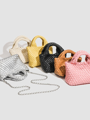 crossbody bag in ivory featuring woven texture and structured fit