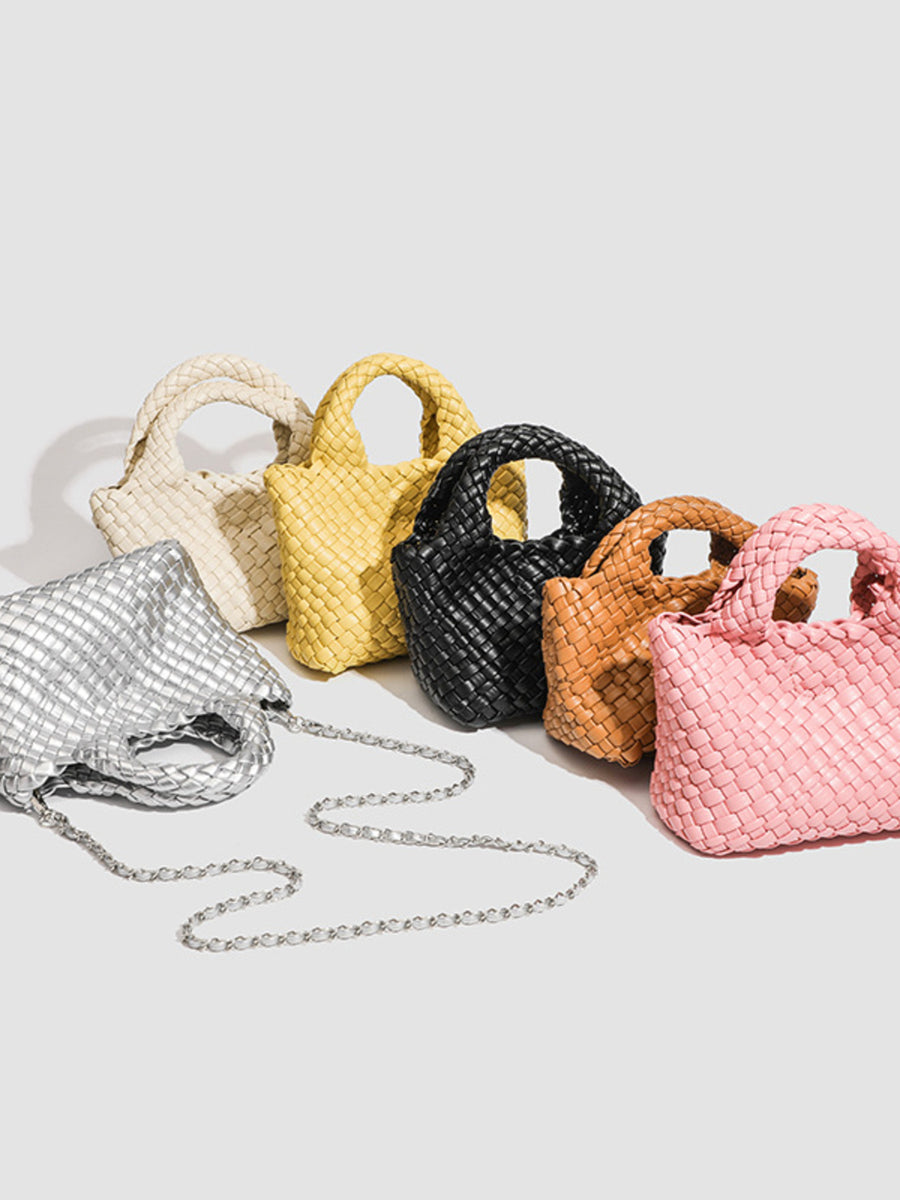 crossbody bag in ivory featuring woven texture and structured fit