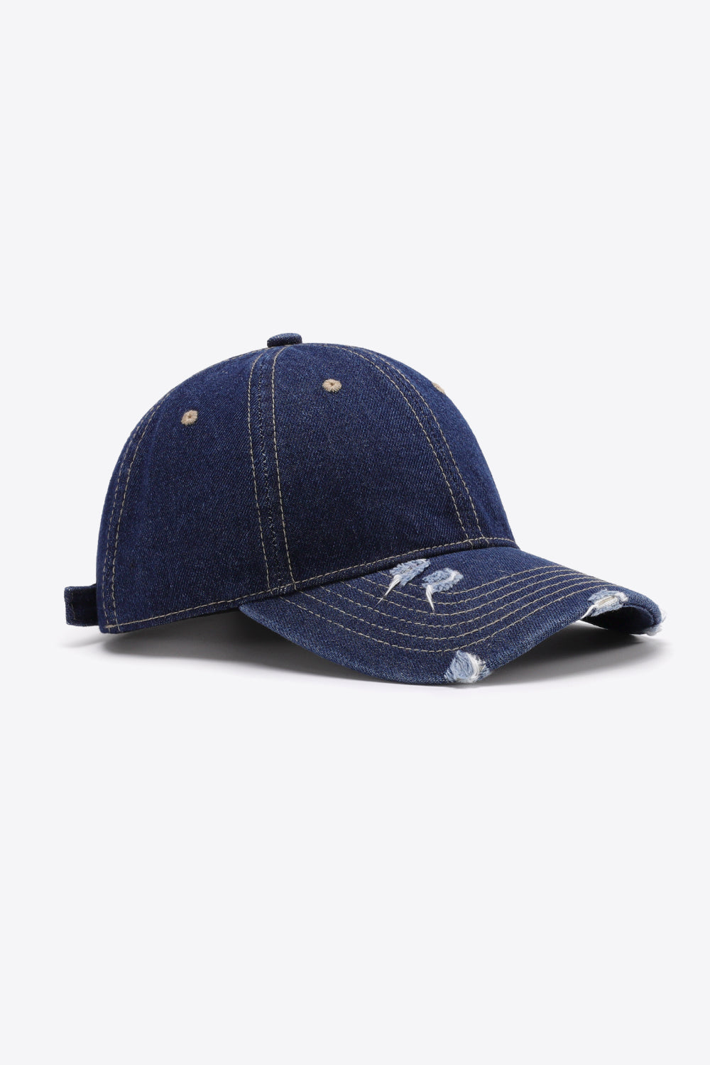 Denim baseball cap in dark navy with distressed brim and adjustable strap