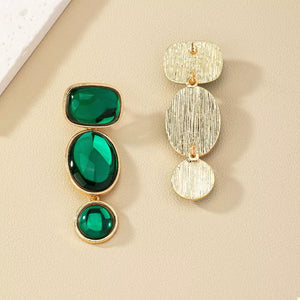 earrings in gold with drop design and long
