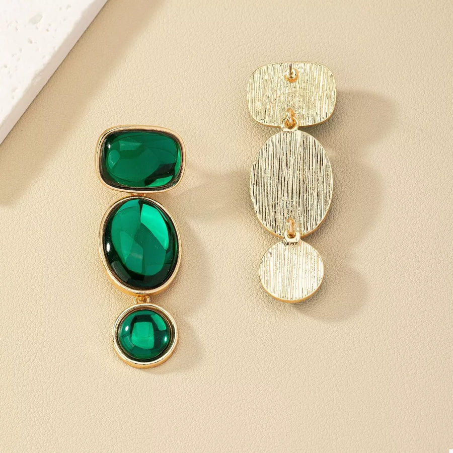 earrings in gold with drop design and long