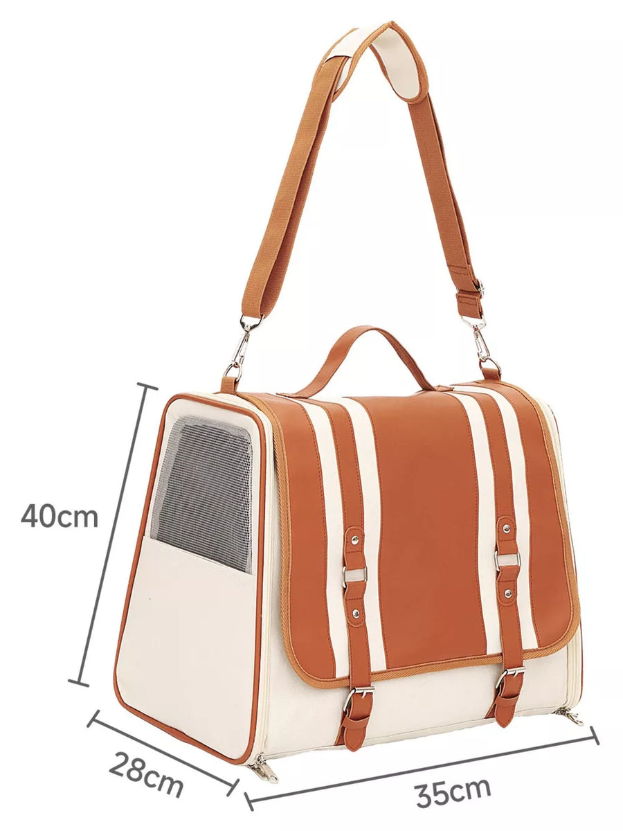 Chic two-tone brown and cream backpack pet carrier with adjustable straps and buckle details.
