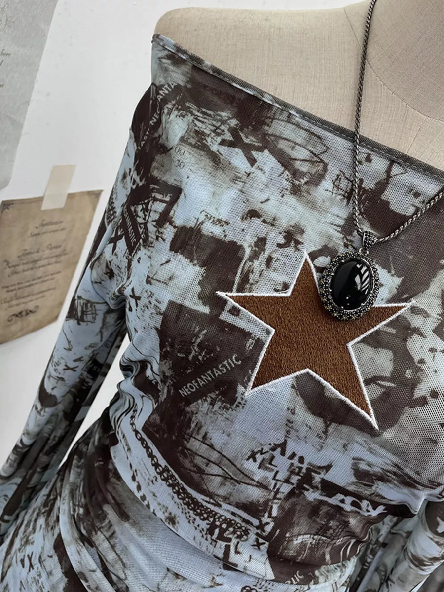 Asymmetrical ruffle hem t-shirt in blue and brown graphic print mesh with star detail.