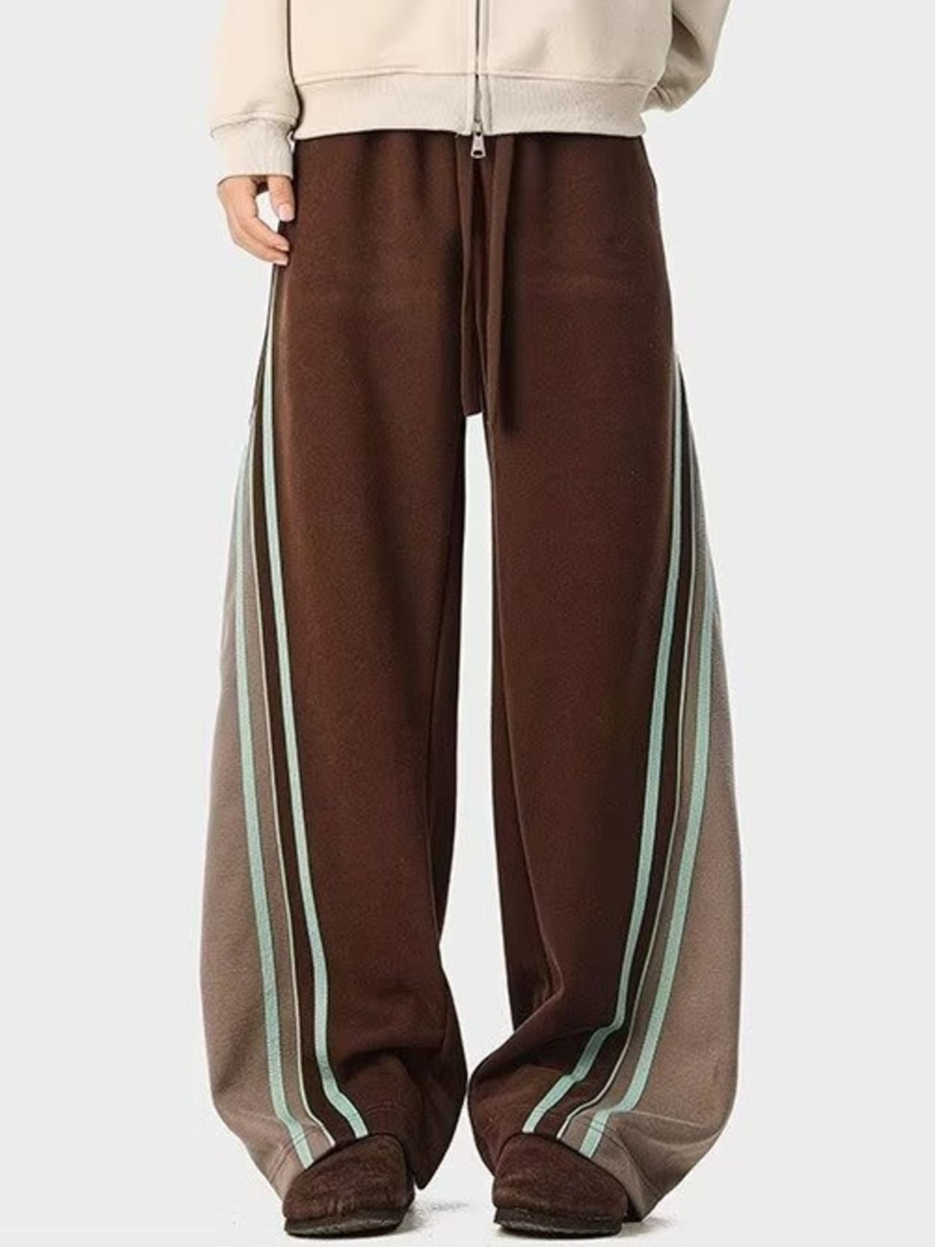 Brown drawstring casual pants with triple stripe detail on the leg