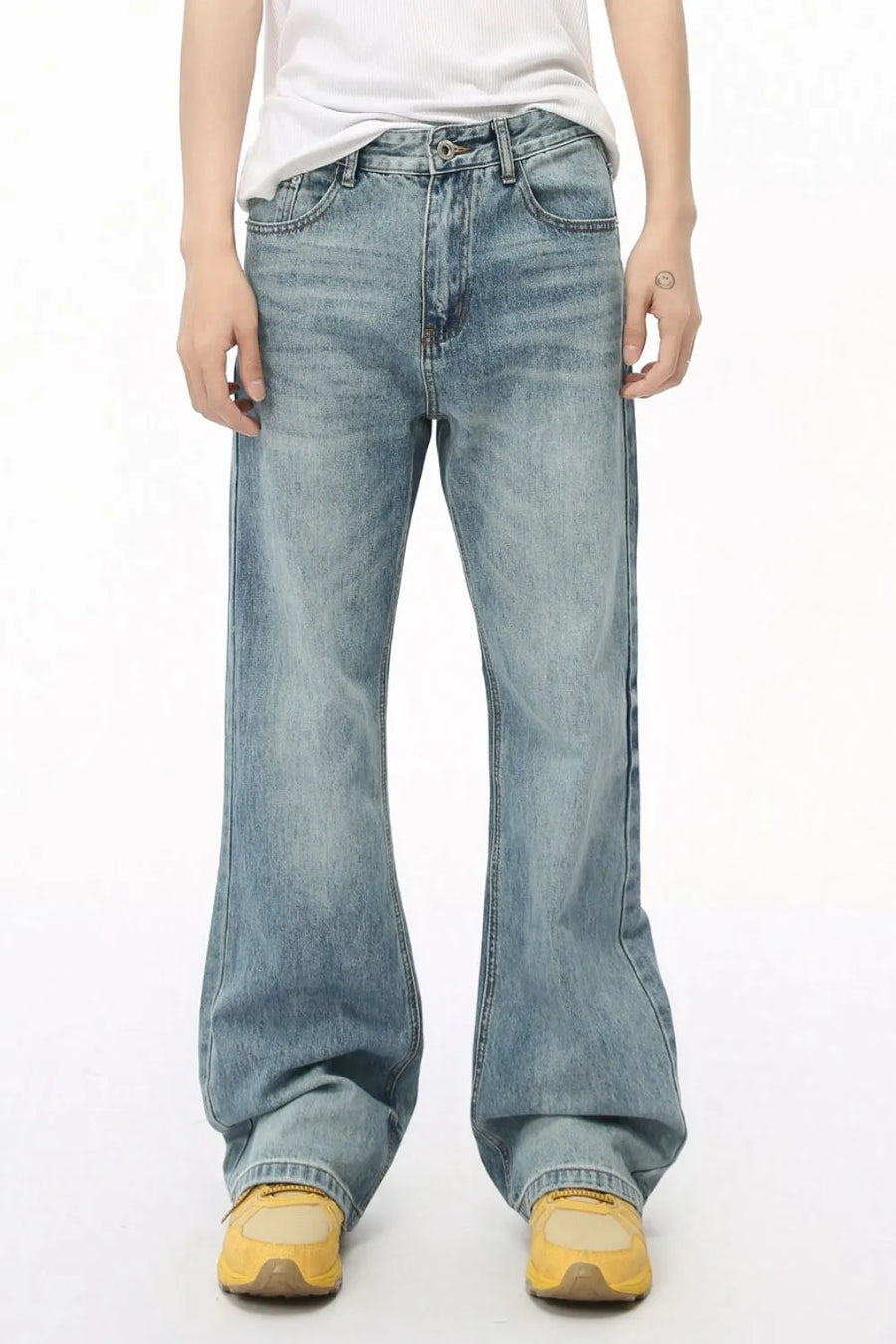 Wide leg denim bell bottom jeans in medium wash, featuring a relaxed fit and flared leg opening.