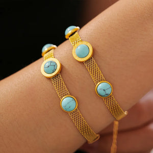 Gold mesh bracelet with turquoise stones and Roman numerals