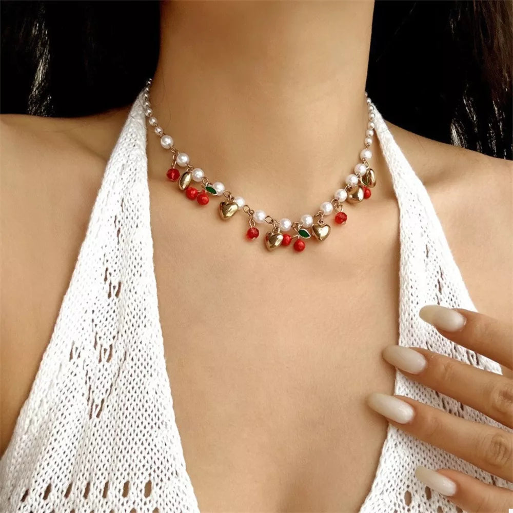 necklace in gold featuring pearl embellishment and choker fit