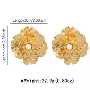earrings in Gold with floral and textured
