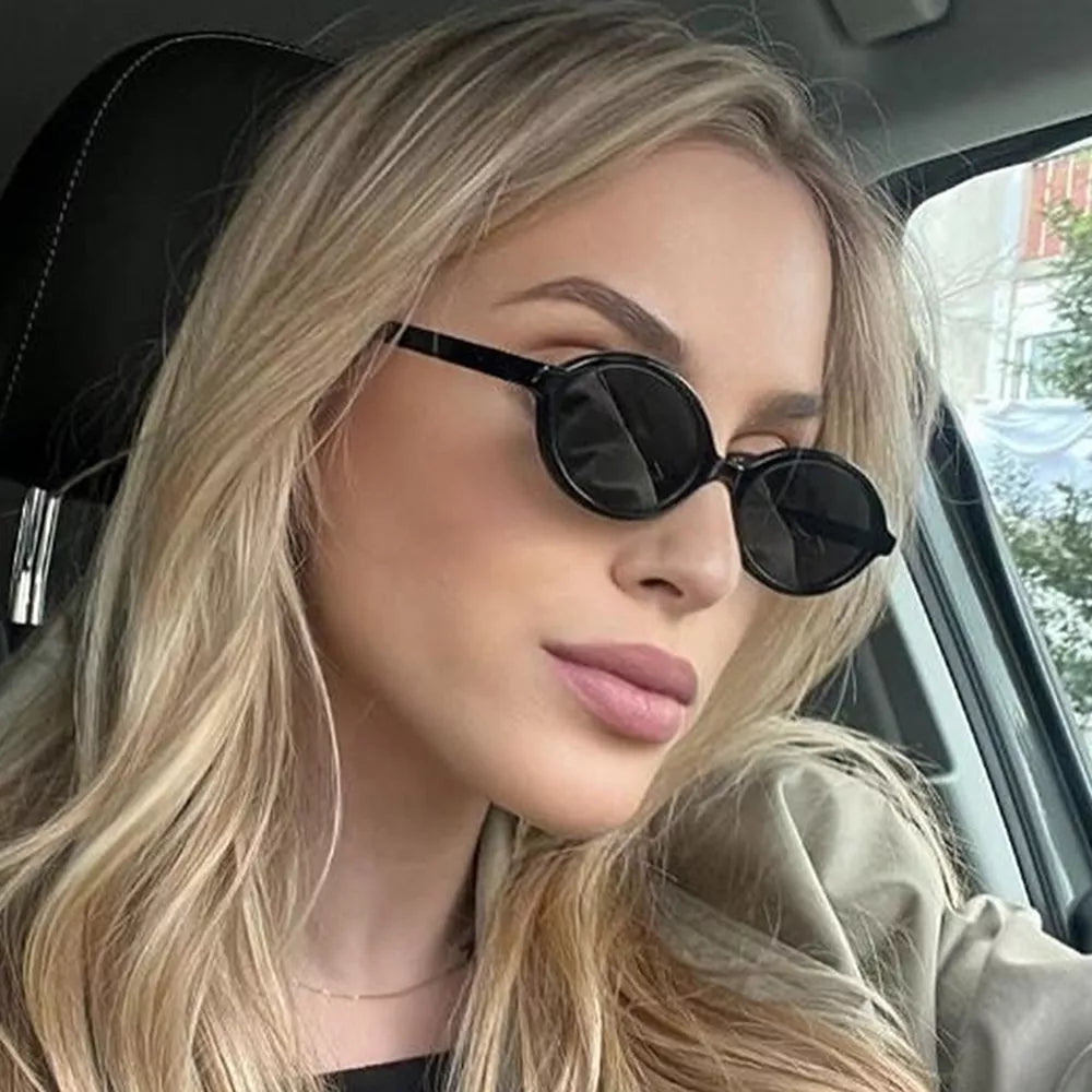 PC Frame material: Polycarbonate Lens material: Polycarbonate Temple material: P sunglasses in Black with oval silhouette