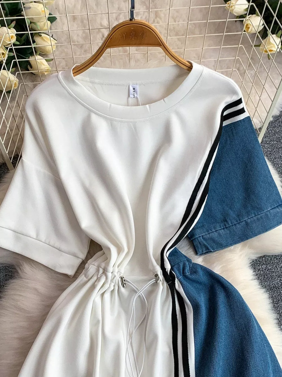 White and denim color block casual dress with drawstring waist and striped sleeves.