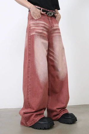 Dip-dye wide-leg denim trousers in rust with a faded effect and relaxed fit.