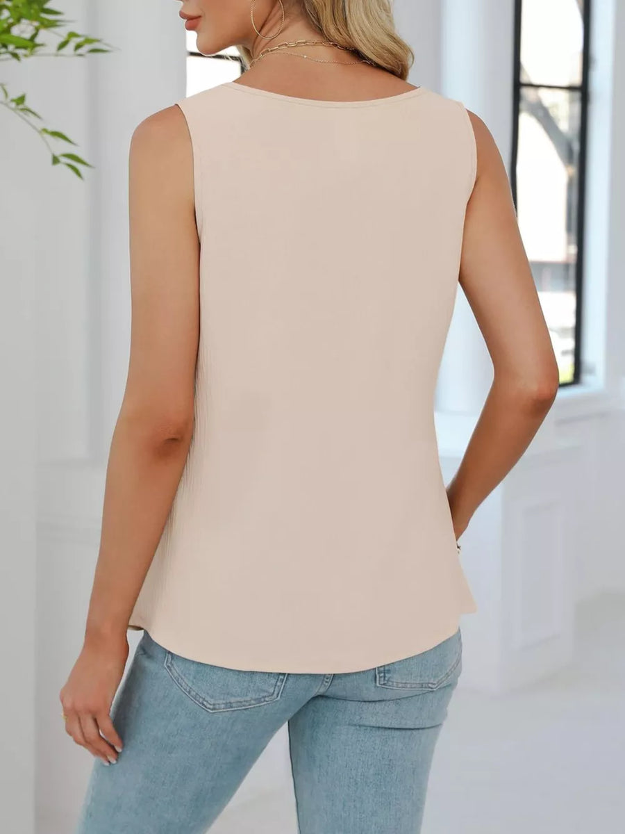 Apricot V-neck tank top with subtle pleating detail and a relaxed fit.