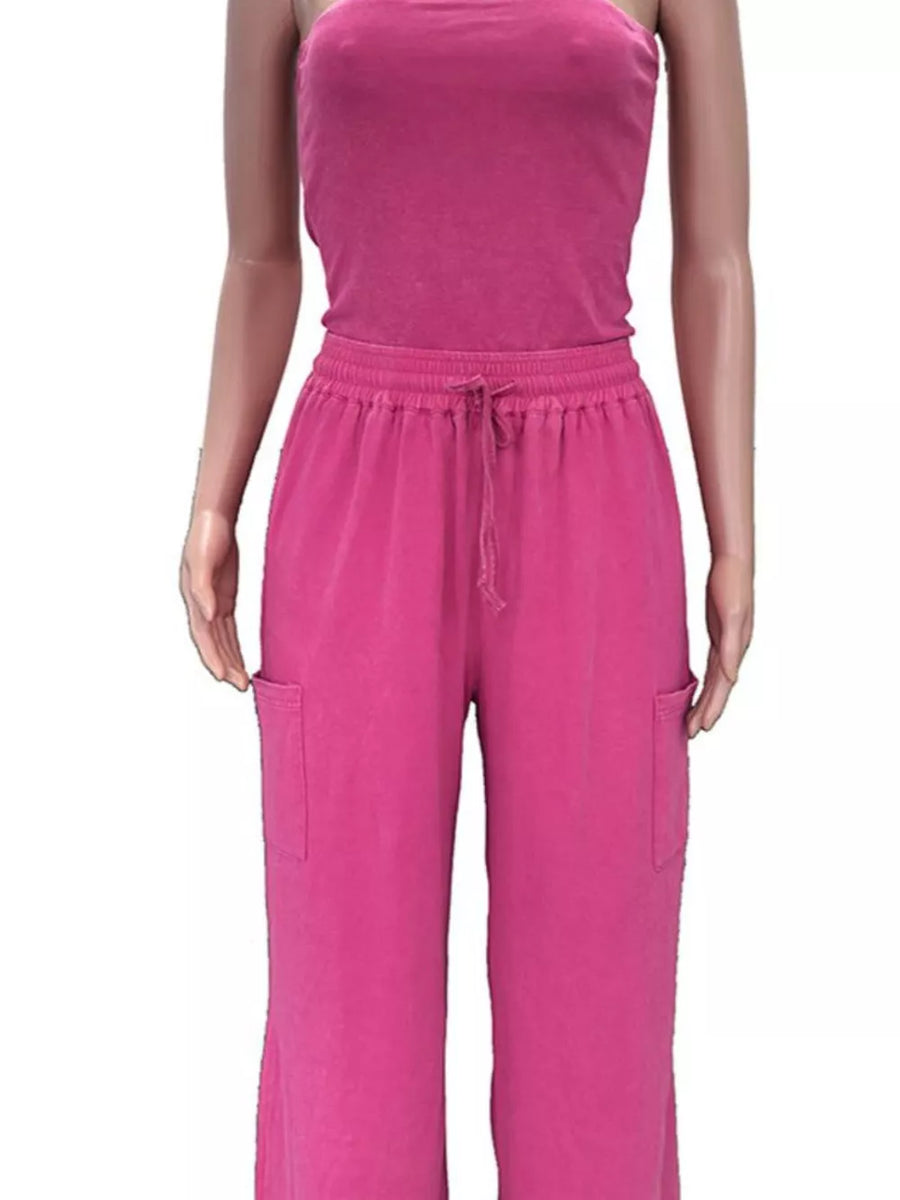 Pink strapless jumpsuit with drawstring waist and cargo pockets