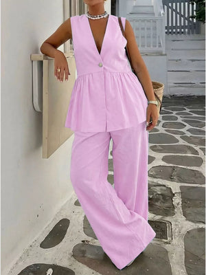 Pink V-neck sleeveless peplum top and wide-leg pants set with button detail.