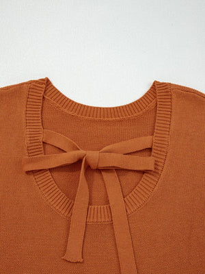 Caramel acrylic blend sweater with a tie bow detail at the back neckline.