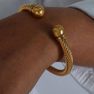 silver bracelet featuring twisted cable design and twisted cable