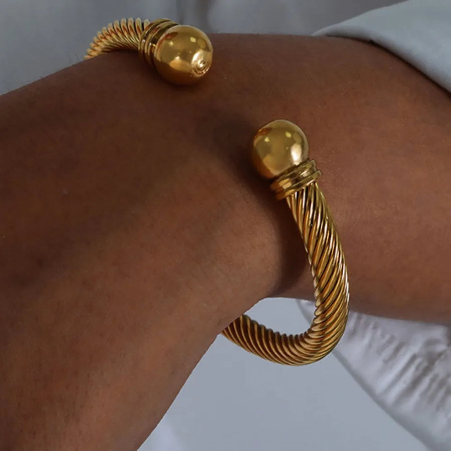 silver bracelet featuring twisted cable design and twisted cable