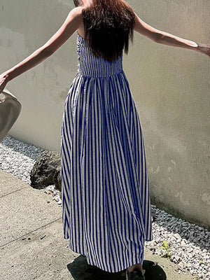 Navy blue and white striped maxi dress with a slit and smocked bodice.