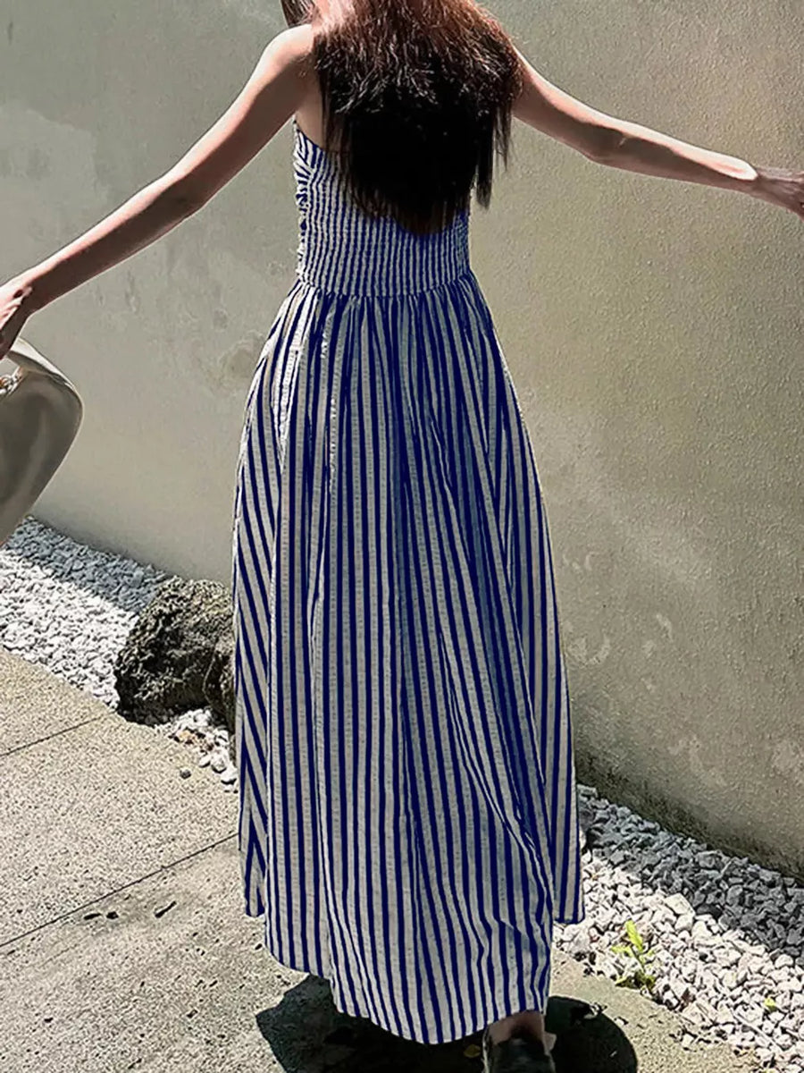 Navy blue and white striped maxi dress with a slit and smocked bodice.