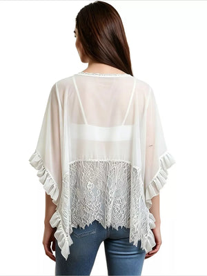 White sheer flowing cover-up tunic with lace panel and ruffled sleeves and hem.