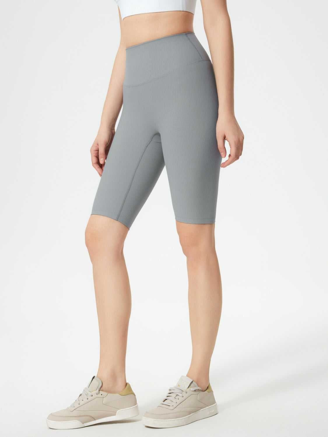 Gray ribbed contour cycling shorts with a high waist and mid-thigh length.