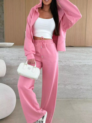 Dusty pink relaxed fit zip-up hoodie and drawstring pants set with white tank top.