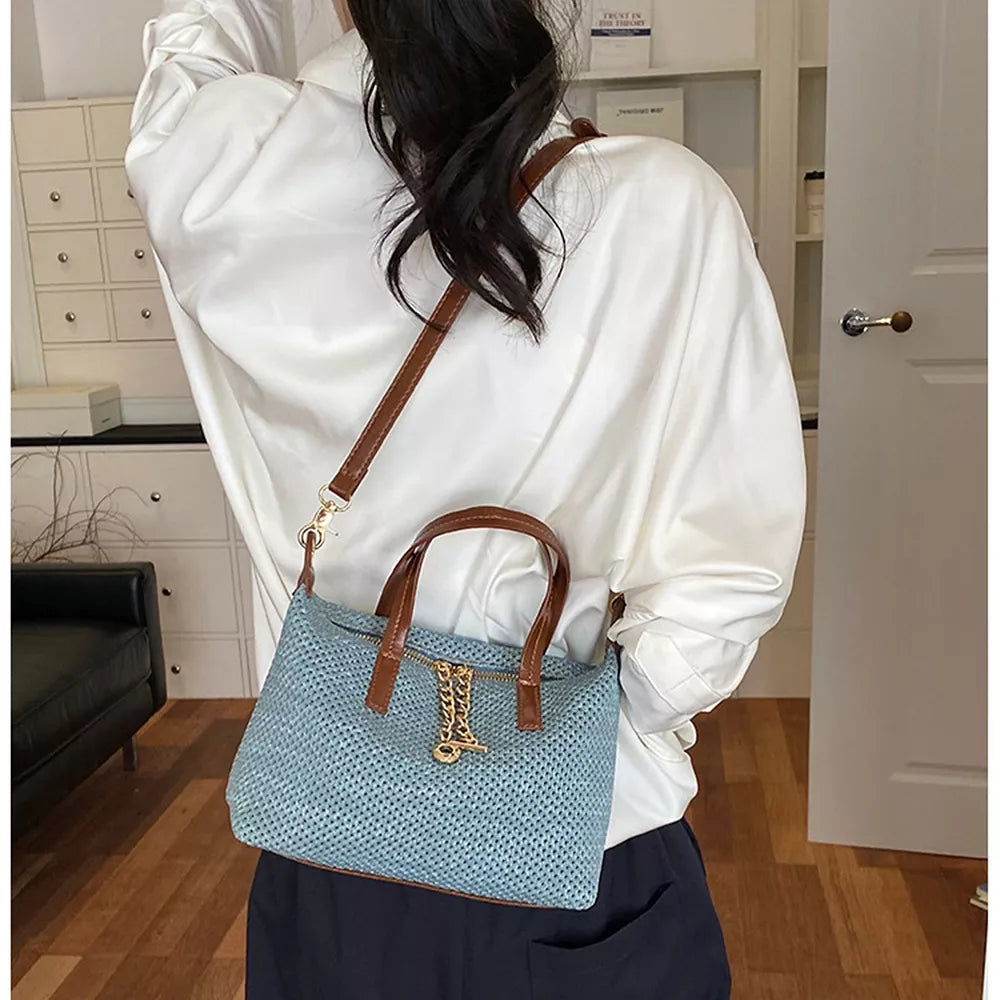 crossbody bag in dusty blue with woven texture and small