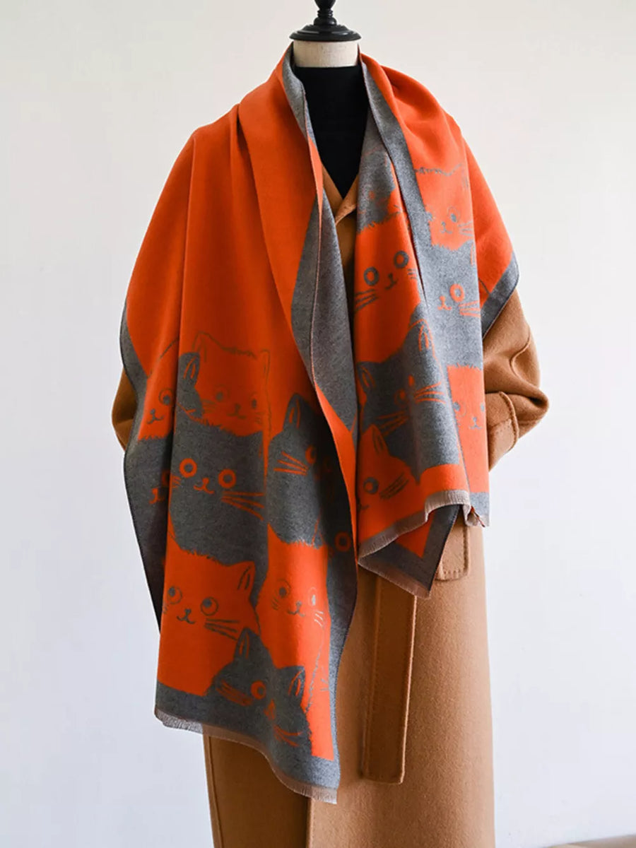 Orange and gray reversible scarf with a cute cat pattern, perfect for cat lovers.