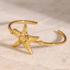 18K Gold-Plated, Stainless Steel Care instructions: Avoid wearing during exercis bracelet in gold with open silhouette