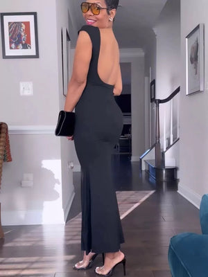 Black backless maxi gown with cap sleeves and a boat neckline.