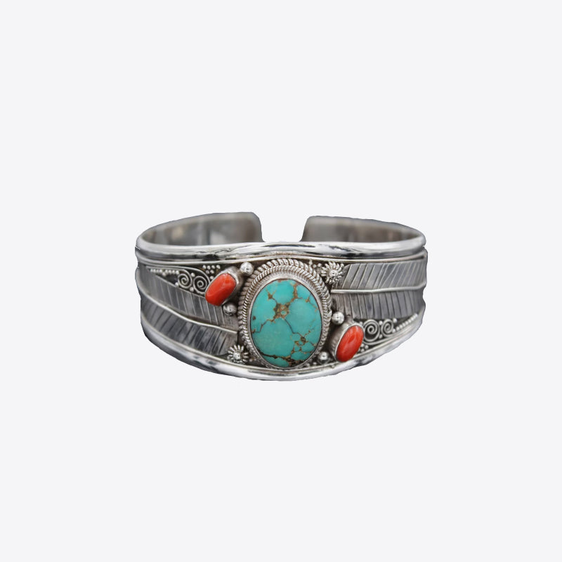 Turquoise and coral feather cuff bracelet with intricate detailing