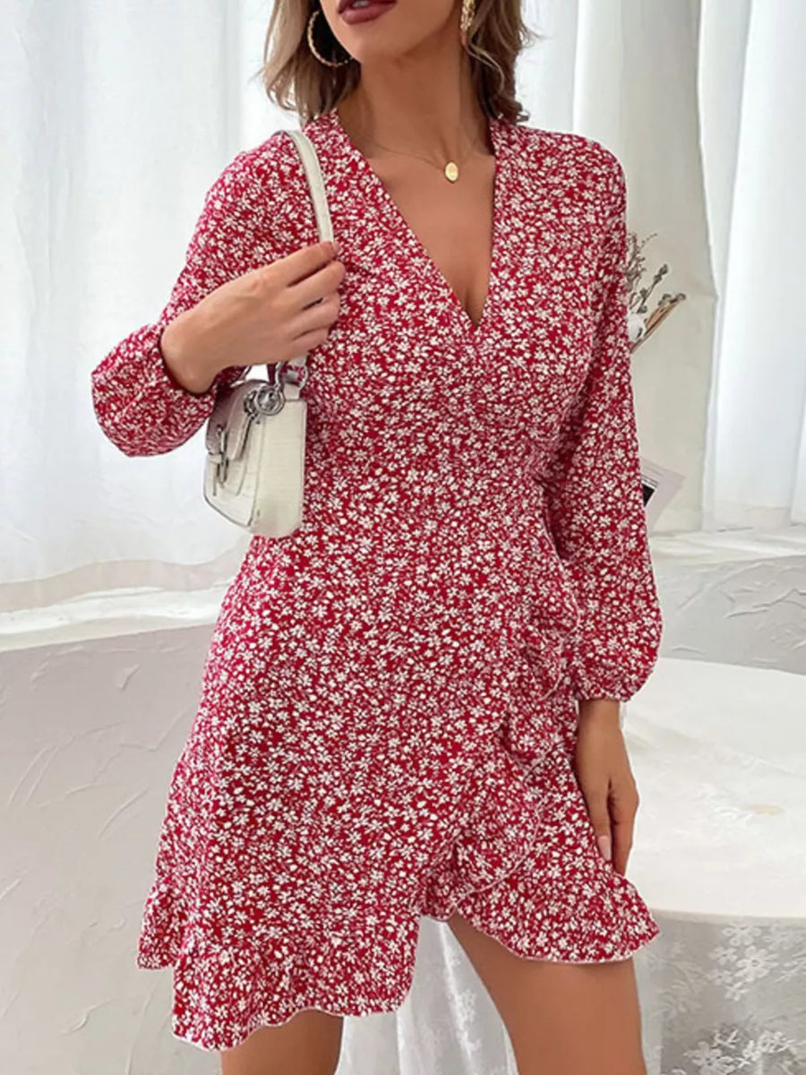 Red floral wrap mini dress with V-neck and ruffled hem.