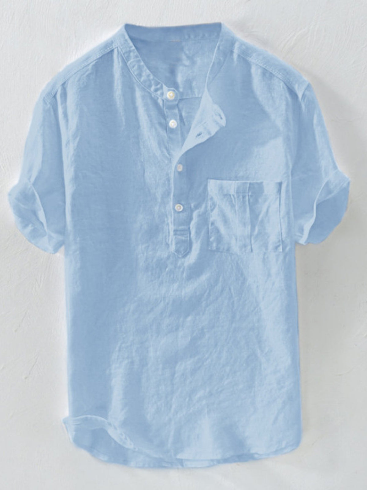Light blue casual shirt with band collar, buttoned placket, and chest pocket.