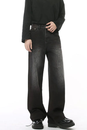 Dark wash denim jeans with a high rise and slouchy, wide leg fit.