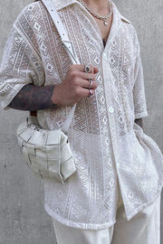 White crochet resort shirt with geometric pattern, button-up, short sleeves.