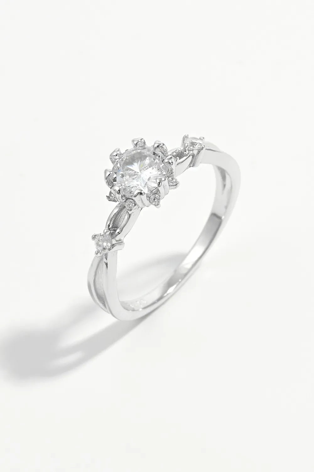 Silver halo ring with floral zirconia accents