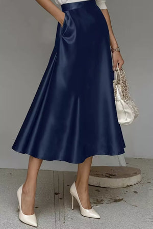 Navy a-line midi skirt with hidden pockets and a lustrous finish.