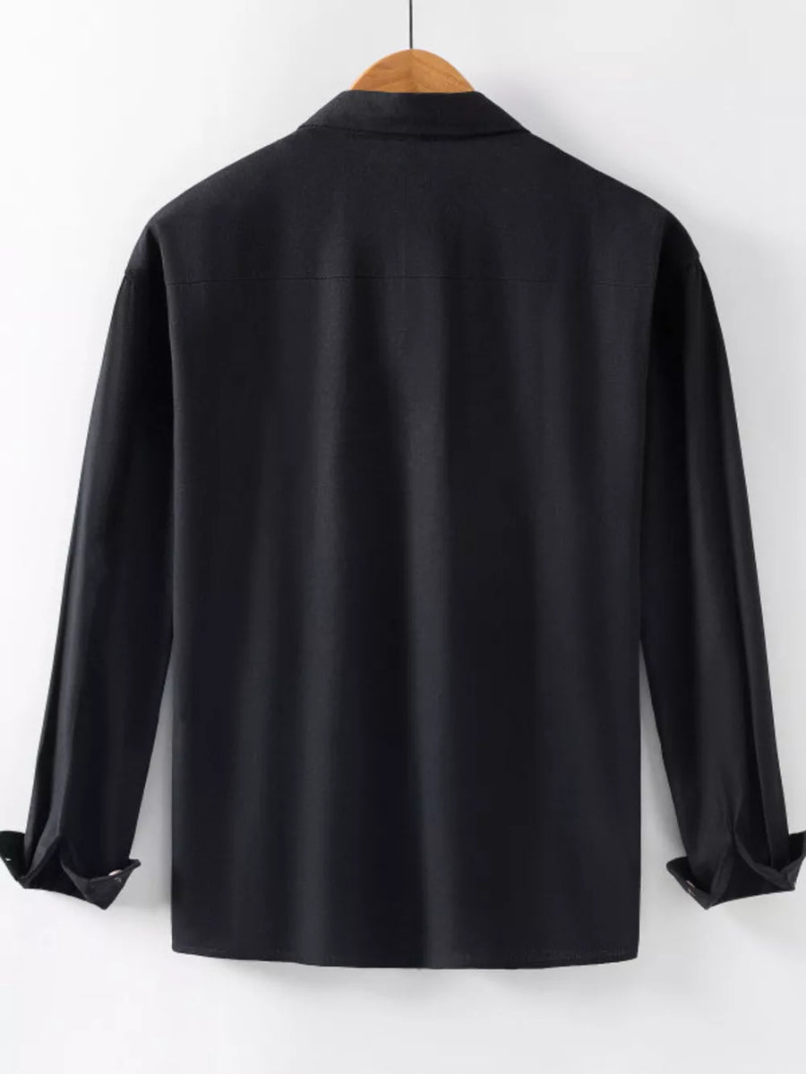 Men's black long sleeve button-up shirt with cuffed sleeves.