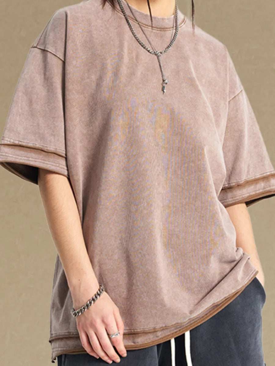 Washed cotton tee in mocha with raw edges and a relaxed fit.