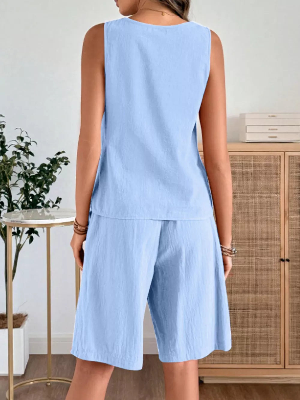 Sky blue relaxed fit tank and shorts set with a round neckline and wide leg shorts.