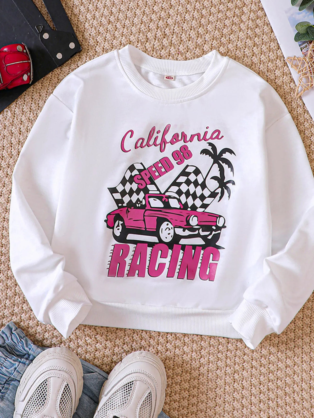 White crew neck sweatshirt with California racing graphic and pink car.