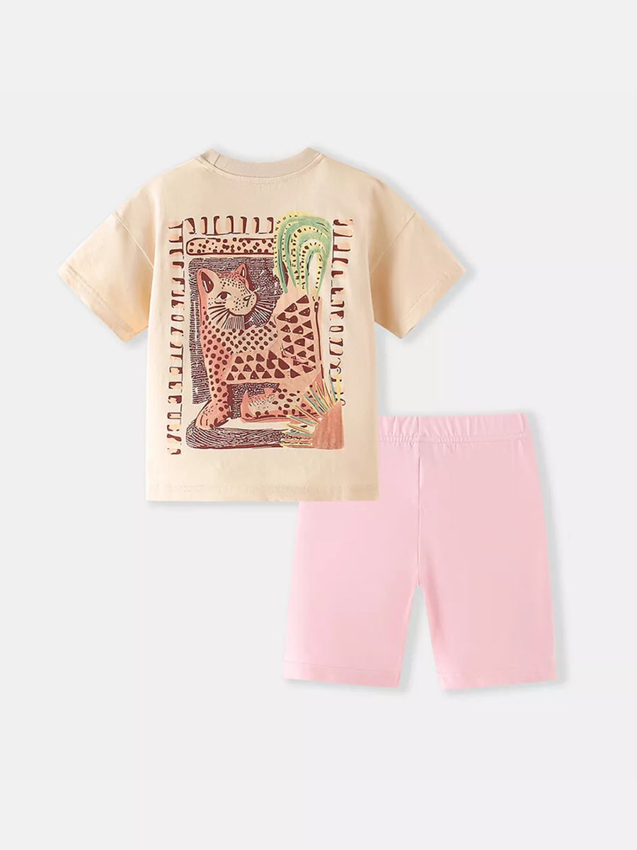Toddler cotton set with cream graphic tee featuring a leopard and cactus print, and pink biker shorts.