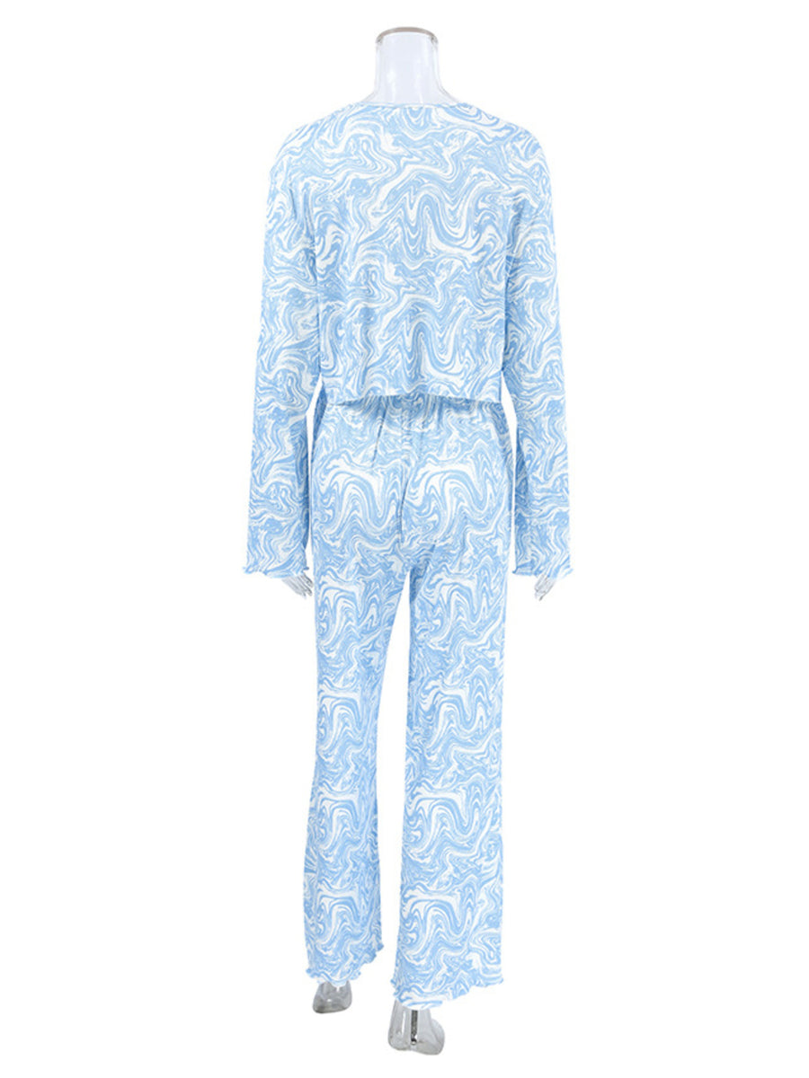 Blue and white marble print loungewear set with drawstring pants and long sleeve top.