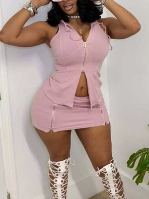 Pink hooded zippered two-piece set with skirt and zipper details.