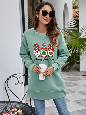 Sage green tunic sweatshirt with Christmas gnomes and Merry Christmas graphic.
