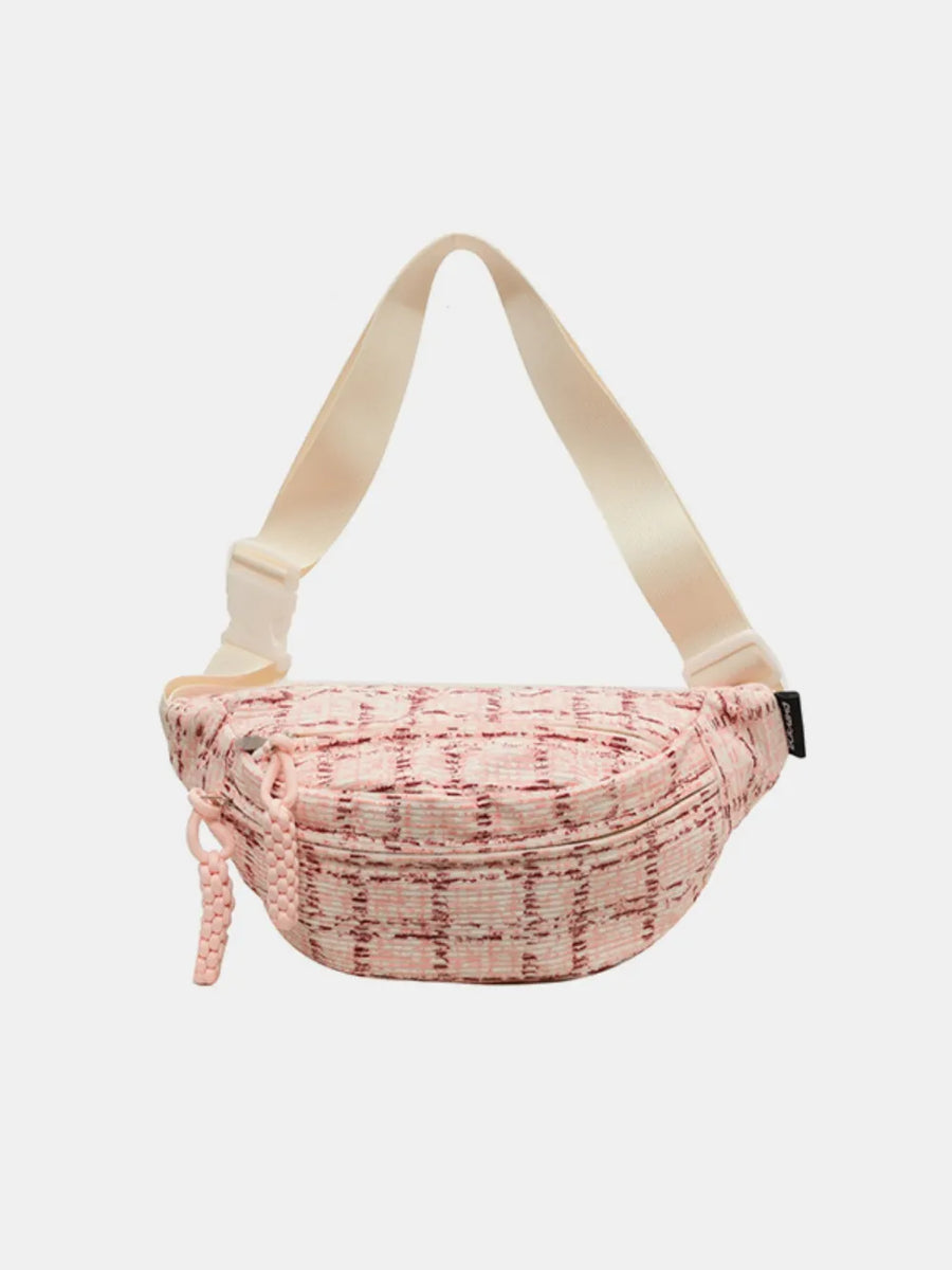 Pink textured tweed belt bag with braided pulls and adjustable strap