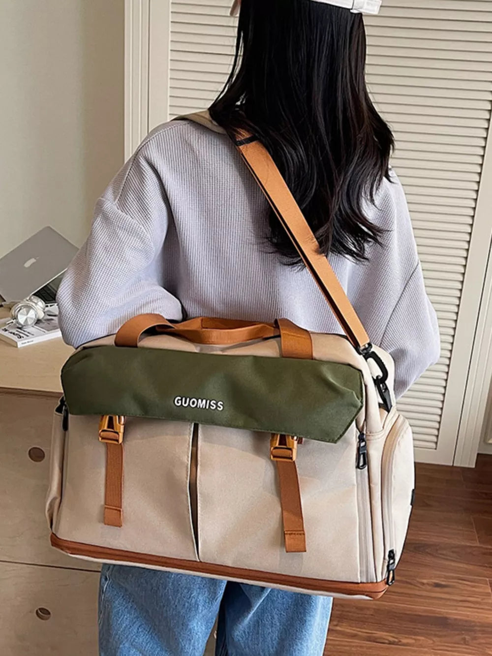 Chic nylon travel bag with olive flap and tan straps, perfect for toiletries.