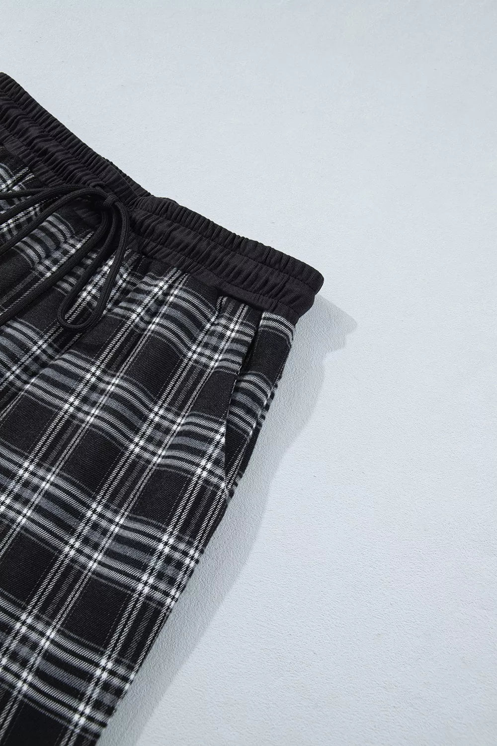 white wide-leg pants with drawstring and plaid
