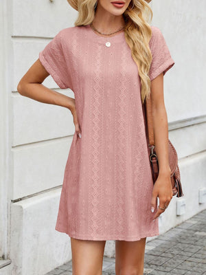 Dusty pink eyelet mini dress with crew neck and diamond pattern detail