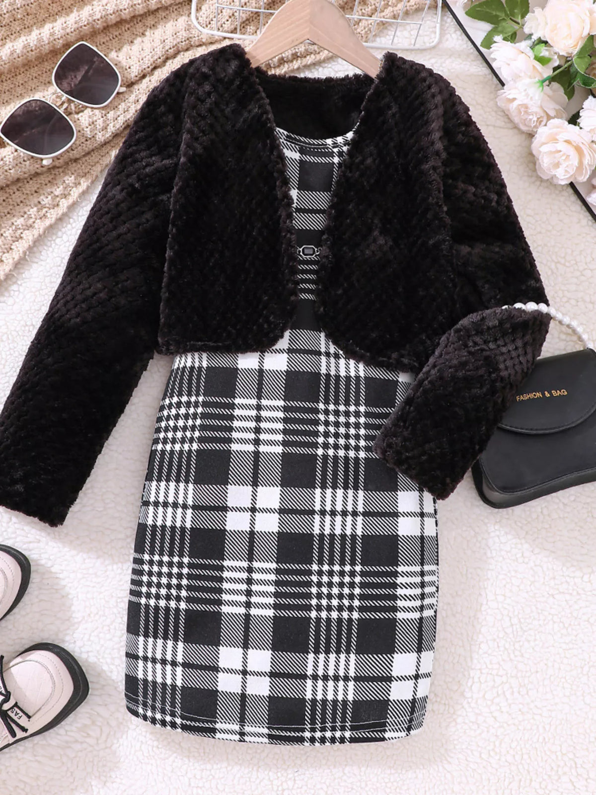 Children's black fuzzy cardigan set with a plaid dress and matching headband.